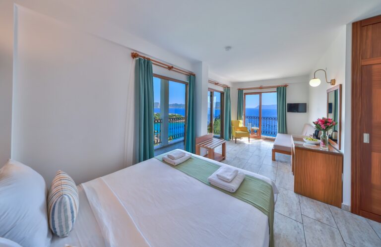 Superior Room with a double bed, seating area and the sea through the balcony doors, Medusa Hotel Kaş