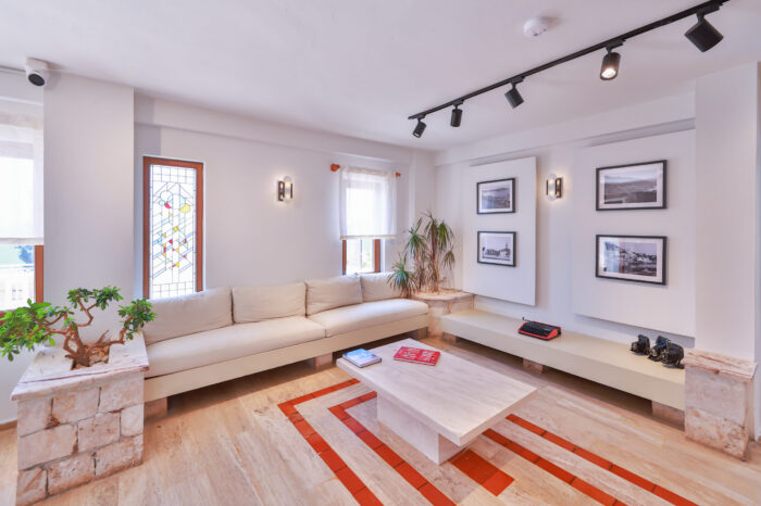 Long lounge with built-in bench seating and a low table, Medusa Hotel Kaş