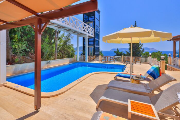 Pool terrace with sun loungers above the sea, Medusa Hotel Kaş