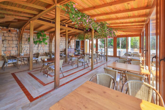 Breakfast terrace under a wooden pergola, Medusa Hotel Kaş