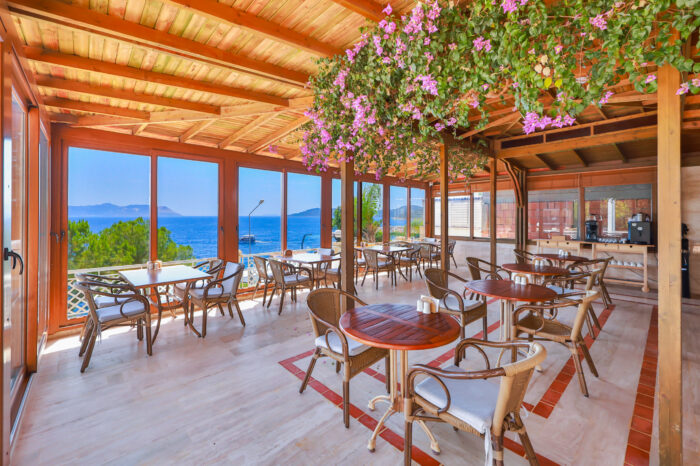 Breakfast terrace under a wooden pergola with sea view, Medusa Hotel Kaş