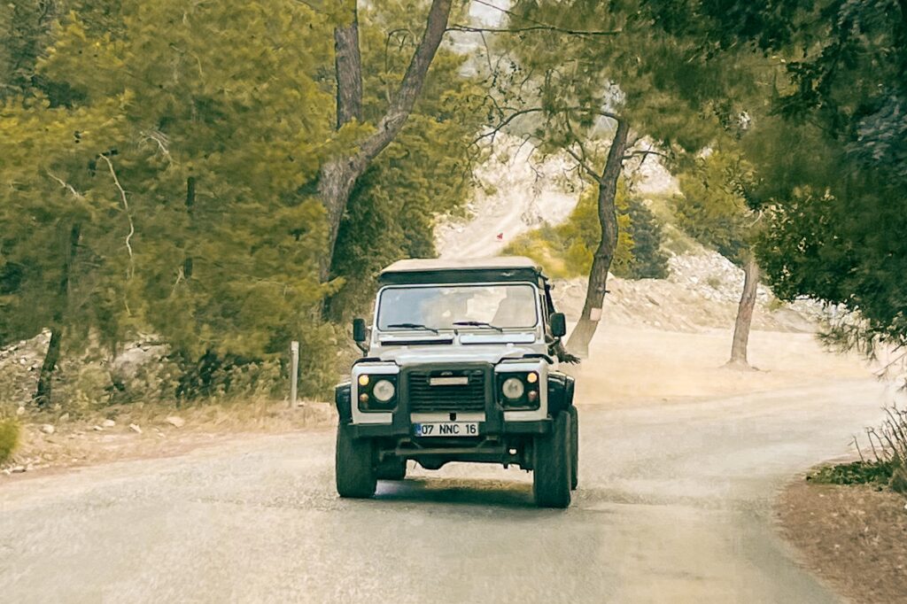 A jeep on the dirt road towards the canyons, Kaş